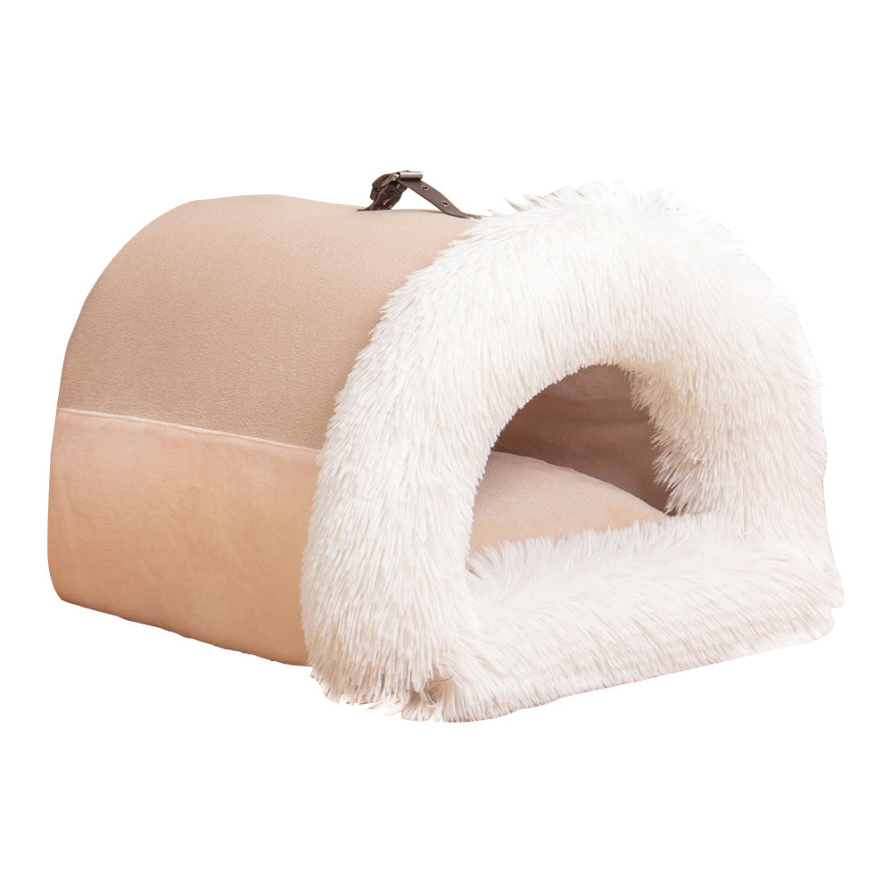 Cat sleeping in winter nest bed
